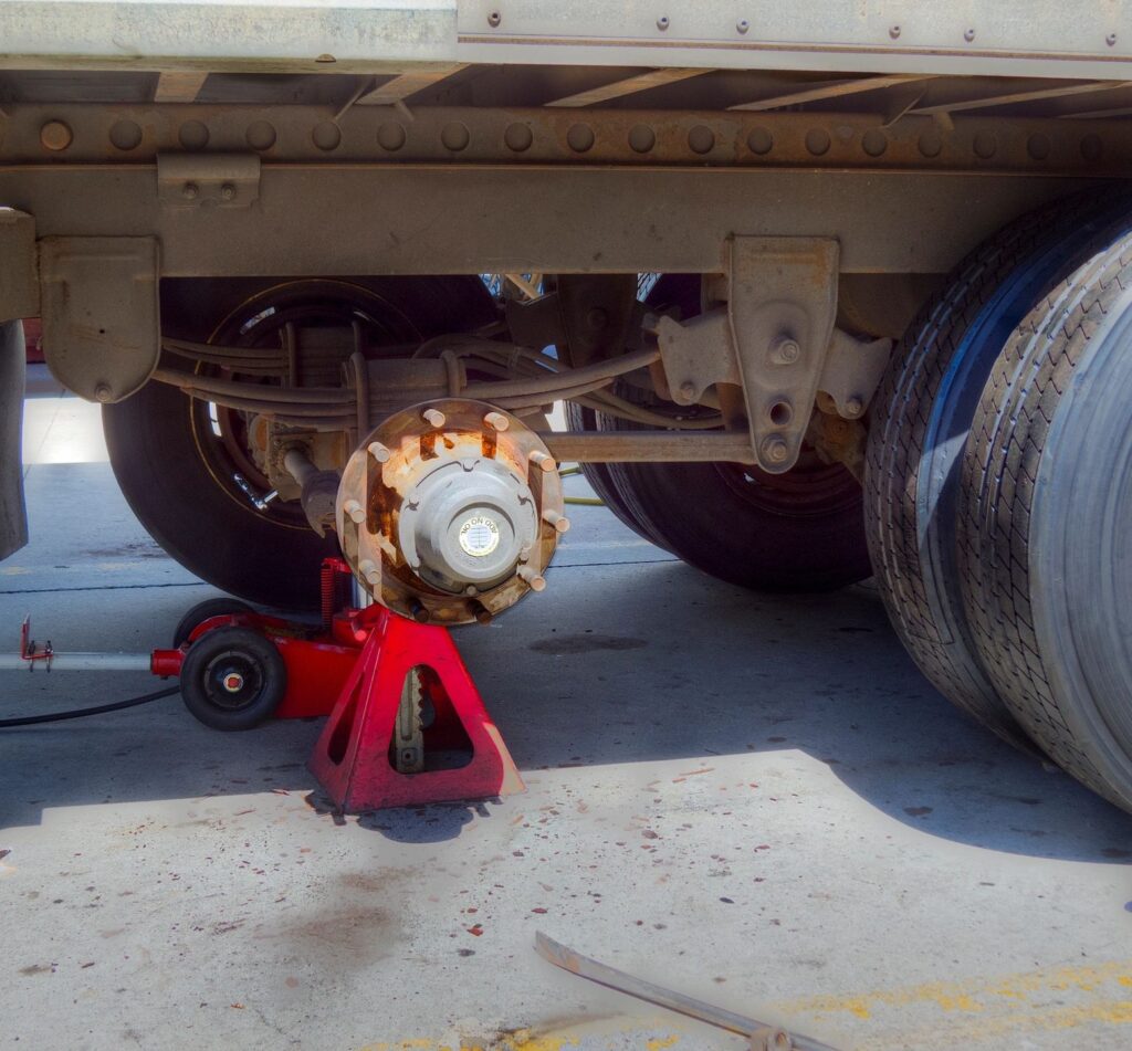 Semi truck trailer brake repair on jack stand
