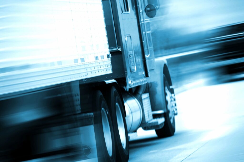 Fast moving semi truck on highway
